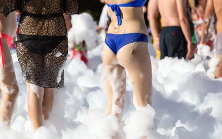 Ass girlfriend at a foamy party on the beachの写真素材