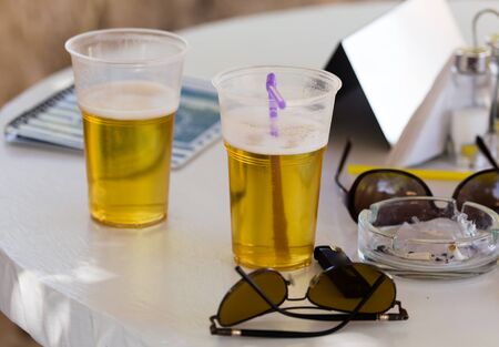 Beer in a glass on a table in a cafe