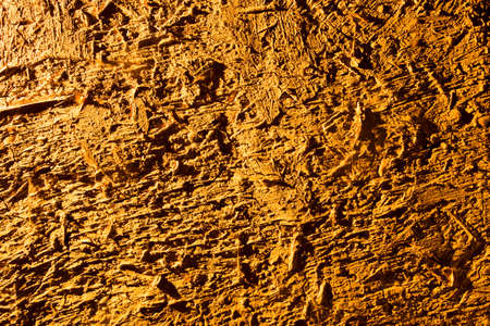 Clay wall in golden light as backgroundの写真素材