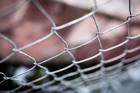 Metal mesh on the fence as a backgroundの写真素材