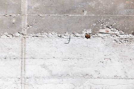 Fresh concrete on the wall as a backgroundの写真素材