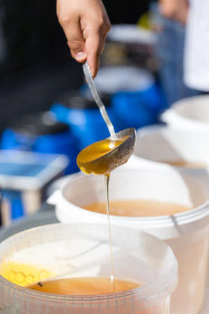 the beekeeper sells honey in the market