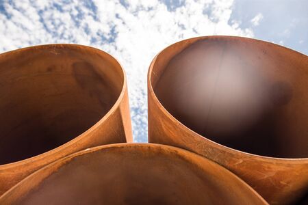 large rusty metal pipes as a background