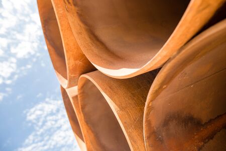 large rusty metal pipes as a background