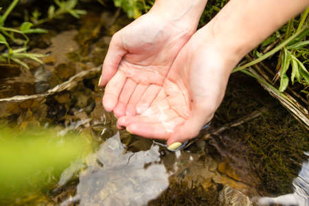 water in the spring in the handsの写真素材