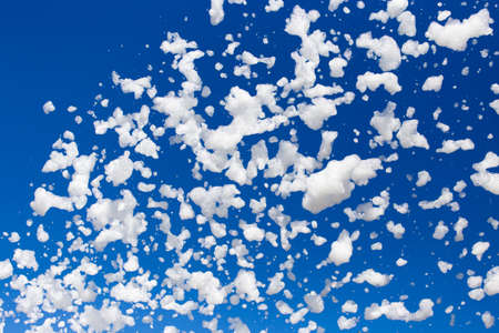 White foam against the blue sky as backgroundの写真素材