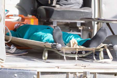 man on a stretcher in the ambulanceの写真素材