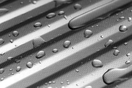 Water on metal surface as background. macroの写真素材