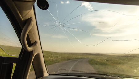 crack on the auto glass as a background .