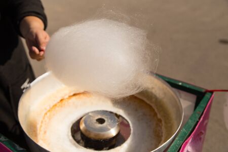 cooking sweet cotton wool in the park .の写真素材