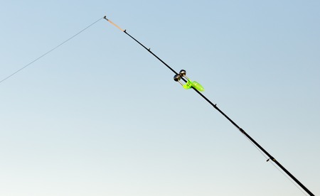 Fishing rod on the river bank in the natureの写真素材