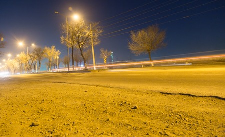 road at night with moving carsの写真素材
