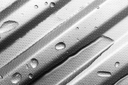 Water on metal surface as background. macroの写真素材