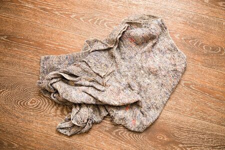the rag rests on the parquet floor .