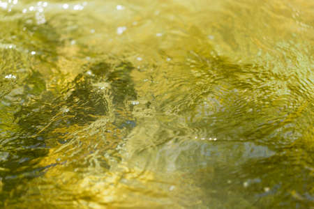 Mountain river surface in motion as a backgroundの写真素材