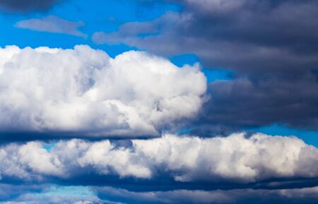 rain clouds on a blue sky as a background .の写真素材