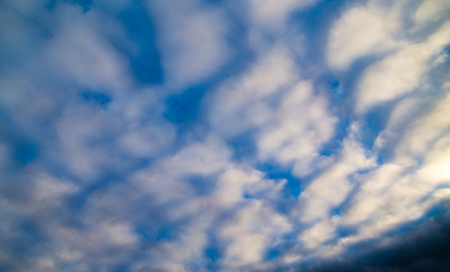 clouds in the sky at sunset as background .