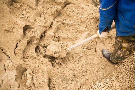 worker with a shovel at the construction site .の写真素材