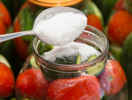 Preservation of tomatoes with cucumbers in cans .の写真素材