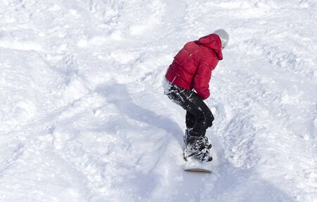Man is snowboarding in the snow in winter .の写真素材