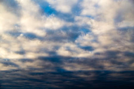 clouds in the sky at sunset as background .