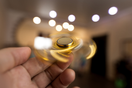 The golden spinner is spinning in his hand .の写真素材
