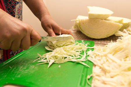 salting cabbage at home in the kitchen .の写真素材