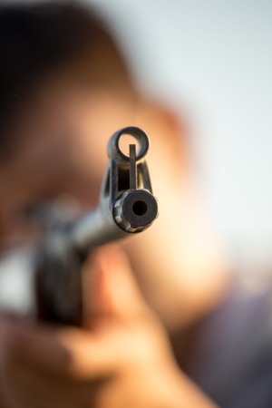 The gun in the hands of the hunter .の写真素材