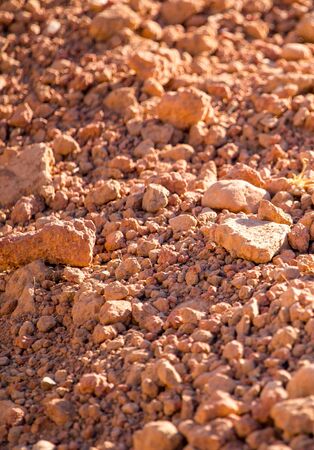 Red clay soil on nature as a background .