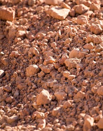 Red clay soil on nature as a background .