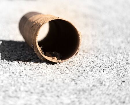 Old rusty pipe at the construction site .