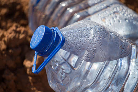Blue plastic water bottle in the nature .の写真素材