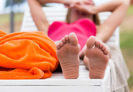 Legs of a girl near the pool