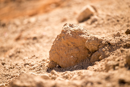 Red clay soil on nature as a backgroundの写真素材