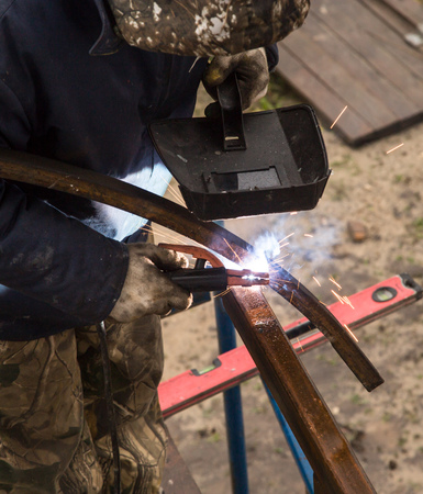 Sparks from welding at the construction site .