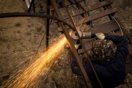 Sparks from metal at the construction site .