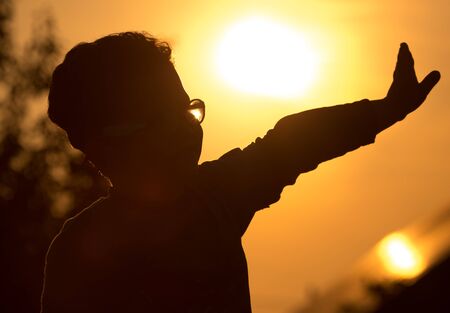 Silhouette of a Boy in the Sunset .の写真素材