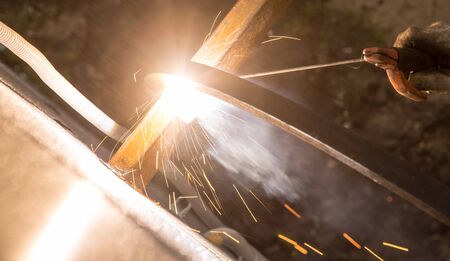Sparks from welding at the construction site .