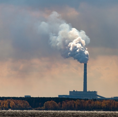 Smoke from pipes from a metallurgical plant .
