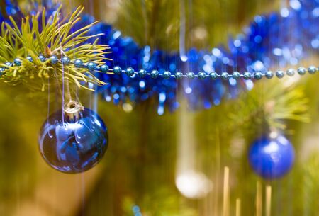 Toys on the green Christmas tree at Christmas .の写真素材