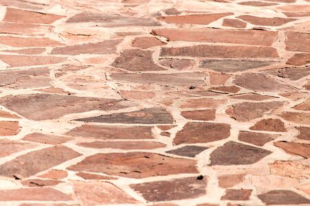 Stone mosaic paving stone as a background .の写真素材