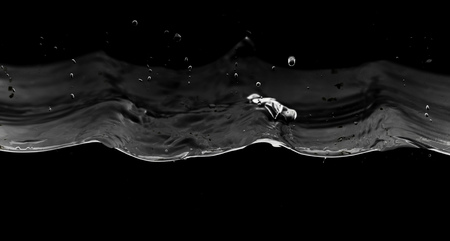 Water smooth with splashes on a black background .の写真素材