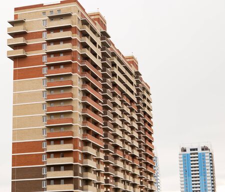 Multi-storey houses in the city as a background .