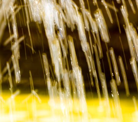 Splashing water from a fountain as an abstract background .の写真素材