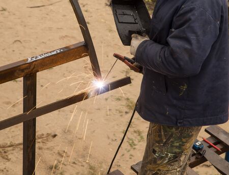 Sparks from welding at the construction site .