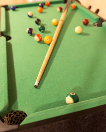 Board game with balls and cue billiards .