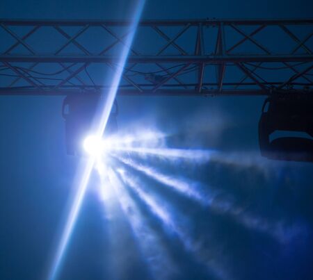 Color searchlight at a concert at night .の写真素材