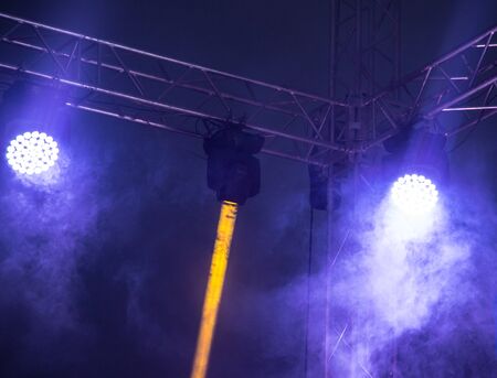 Color searchlight at a concert at night .の写真素材