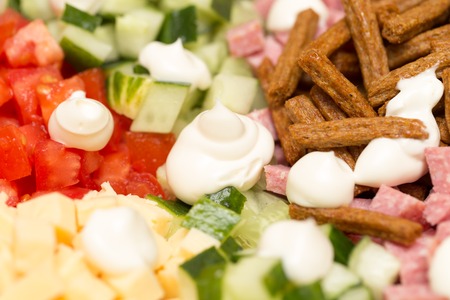 Mayonnaise on a salad on a table .の写真素材