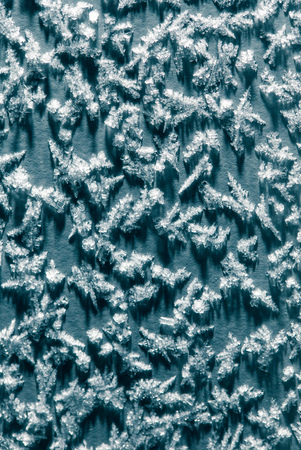 Snowflakes on a blue background. Abstract texture